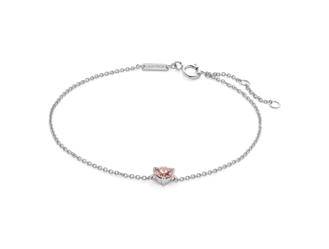 Front view of pink 0.25 carat round brilliant solitaire bracelet in 14k white gold