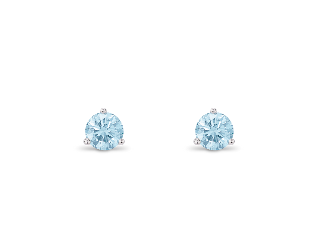 Front view of blue 0.5 carat round brilliant solitaire studs in 14k white gold