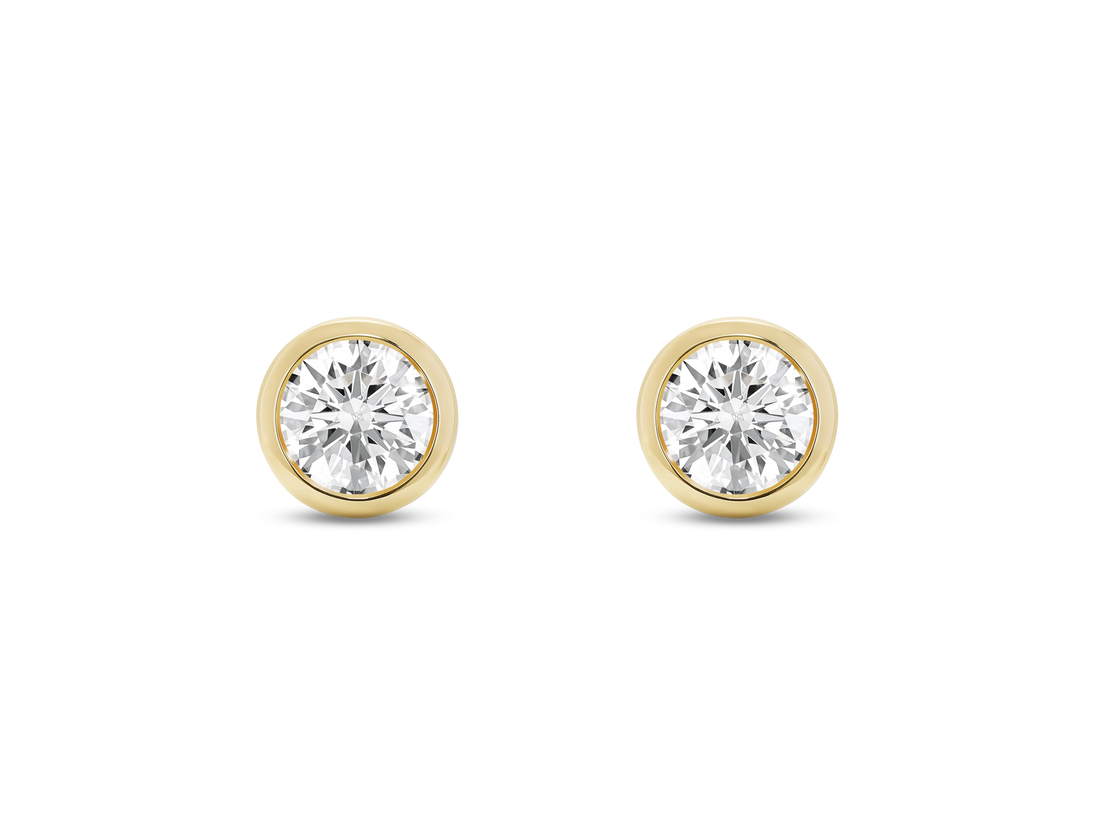 Front view of white 1 carat total weight round brilliant studs in a 14k yellow gold bezel setting