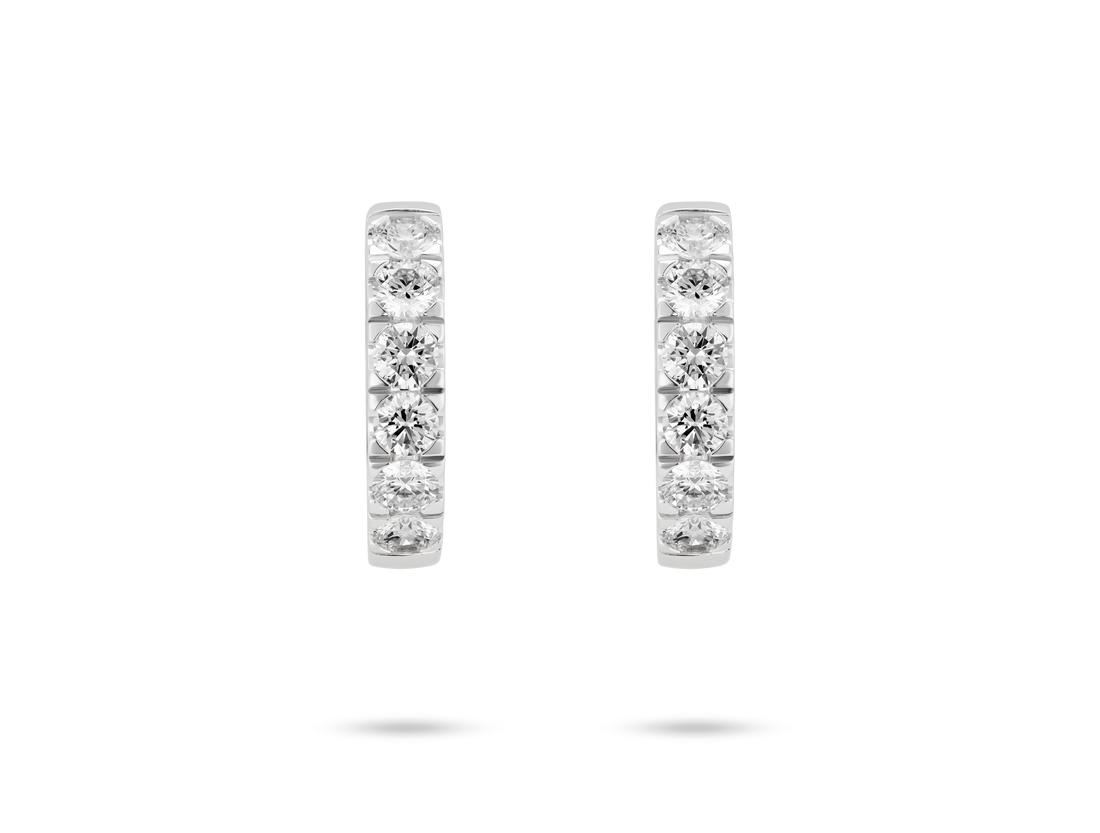 Front view of 1.2 carat total weight pavé huggie hoops in 14k white gold