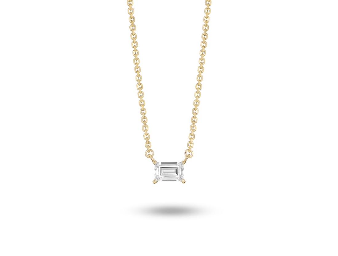 Front view of 0.25 carat baguette cut solitaire pendant in yellow gold